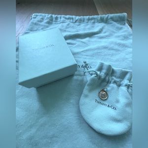 RARE AUTHENTIC Tiffany and Co. Round tag charm with Tiffany box.